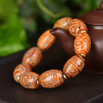 Natural Tibetan Wind-Carved Nine-Eye Dzi—Double Tiger Tooth Agate Bracelet